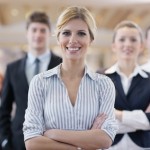 business woman standing with her staff at conference